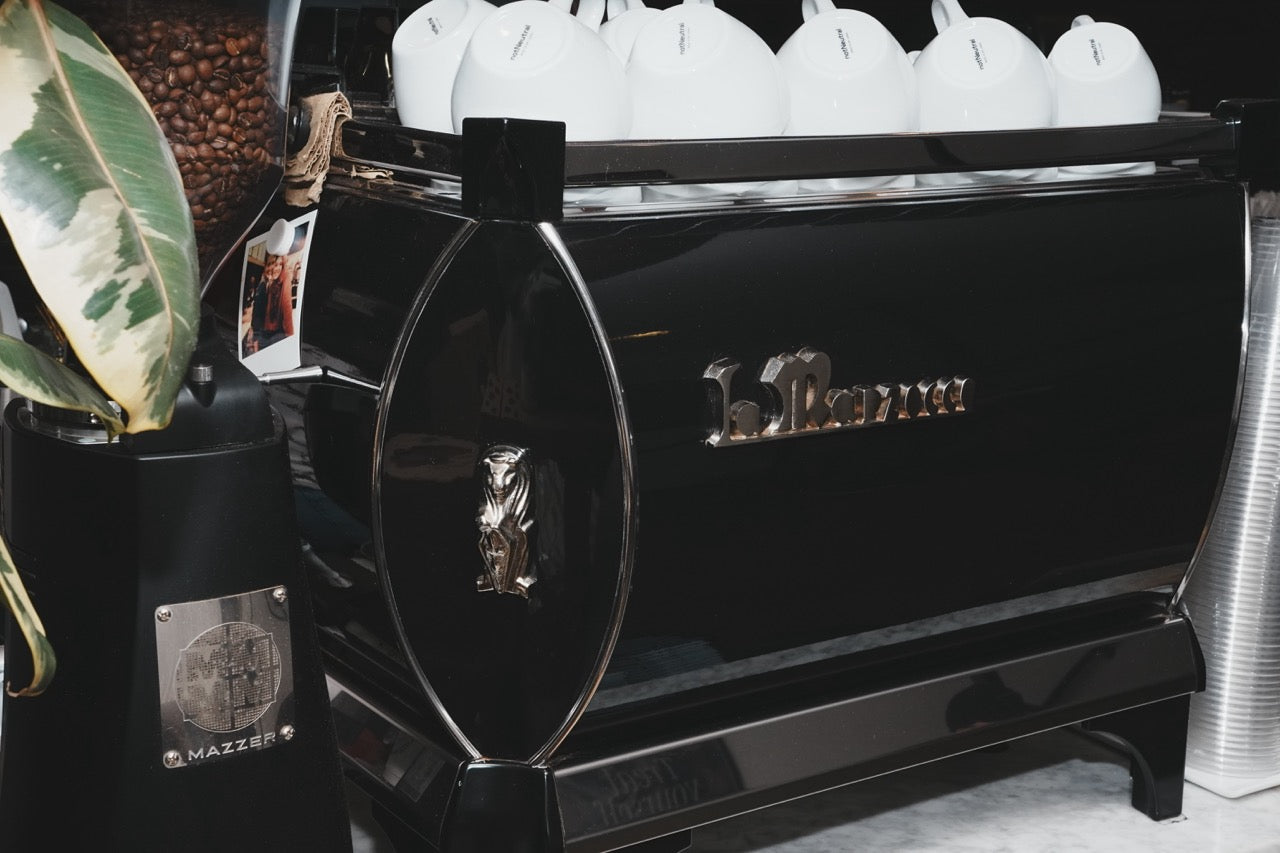 Polished La Marzocco espresso machine detail at a local coffee shop, Auburn, California