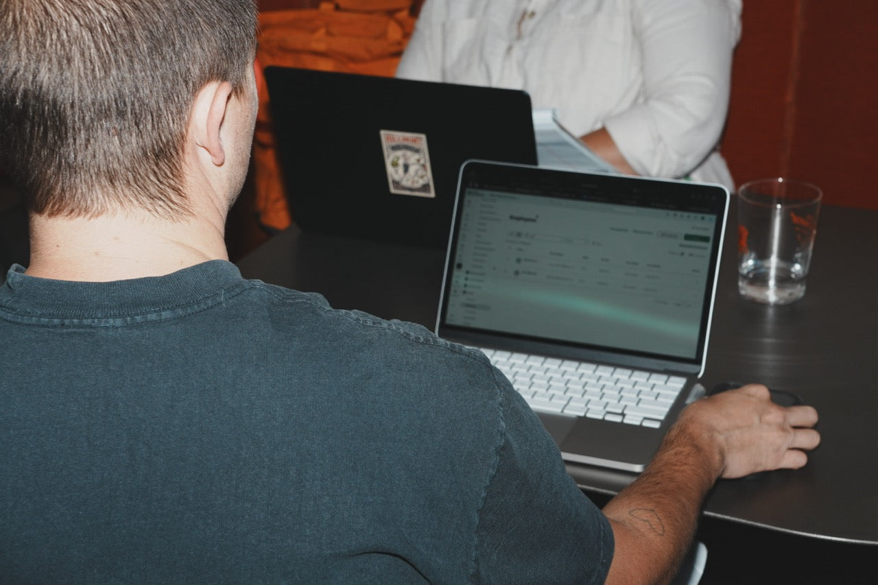 Laptop showing an email dashboard on a cafe table in Auburn, California